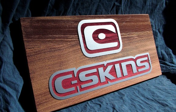sandblasted-c-skins-wetsuits-point-of-sale-in-wood - the grain - wooden sign